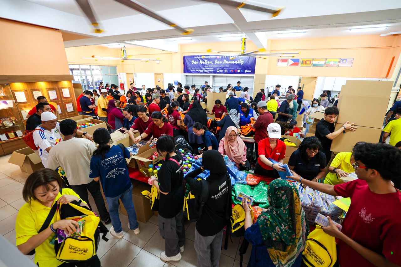 About 300 local volunteers of different religious beliefs gathered at the Renala Jena Church in Yishun on Sunday to pack 5,000 