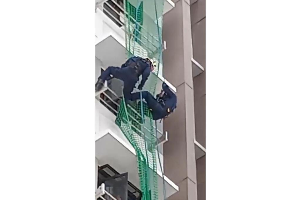 The old man sat in a dangerous place by the window on the 13th floor. Civil defense cast a net to save people